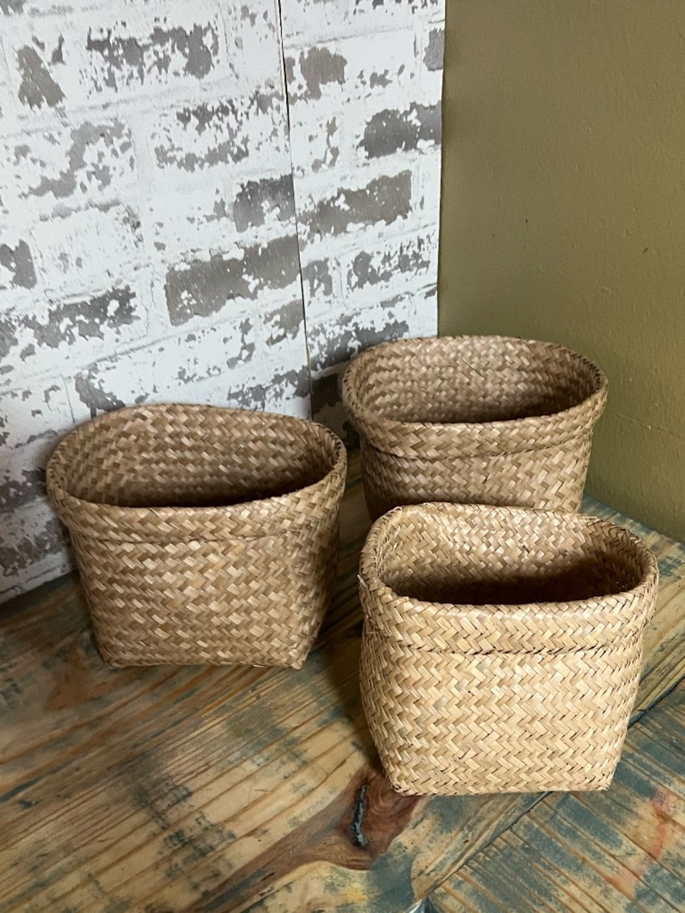Set of three nesting woven seagrass baskets